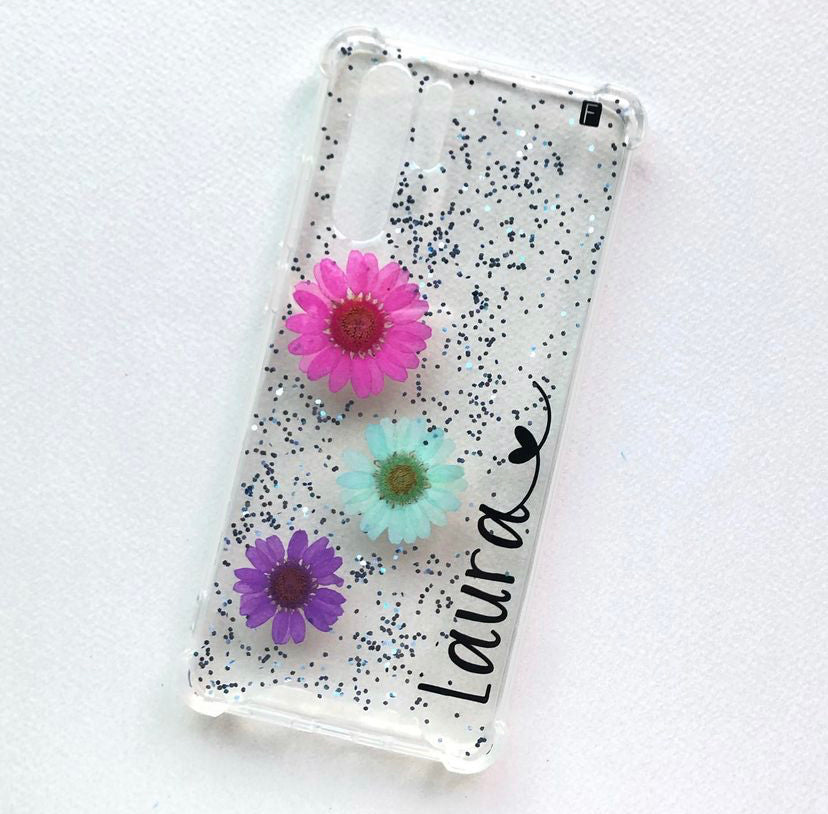 Flores fucsia, aqua y morada